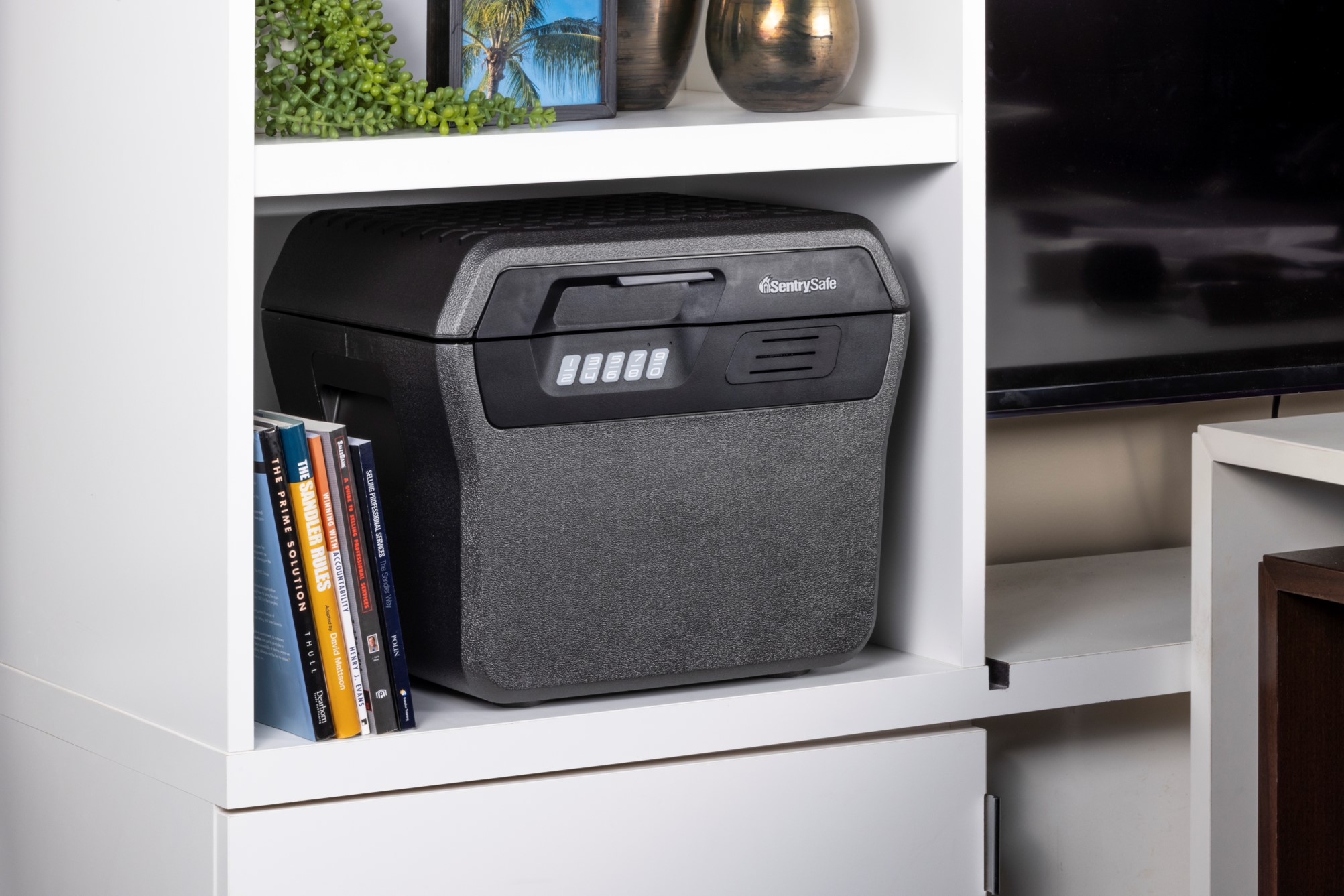 Image of a digital fire/water proof safe on a shelf